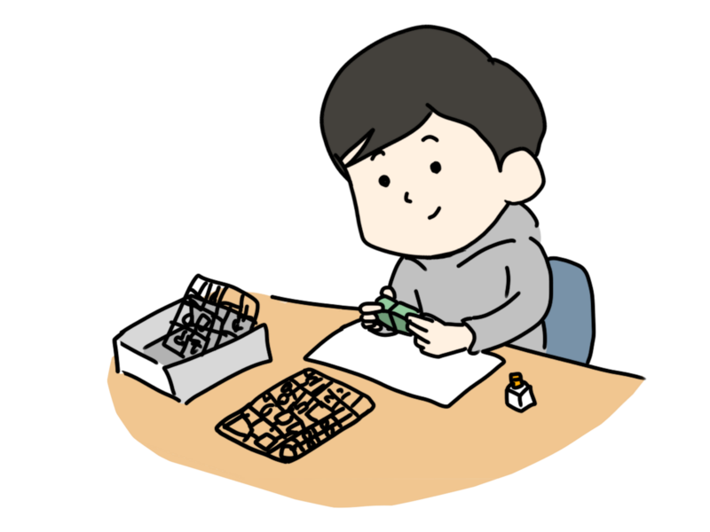 積みプラしていたキットを作っている男性